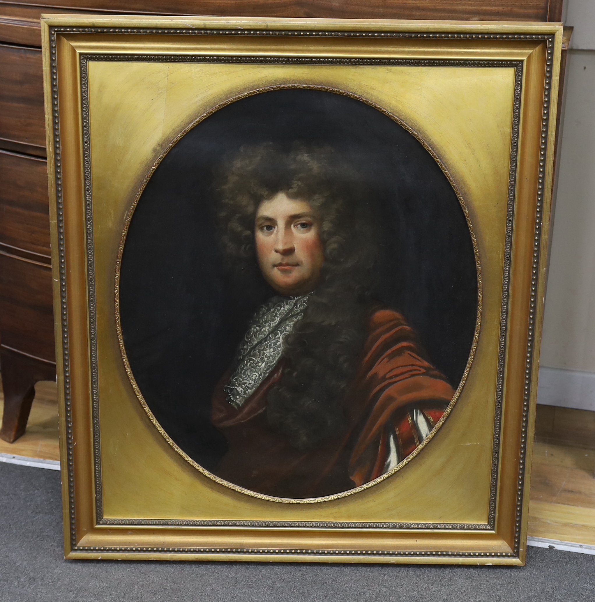 English School, oil on canvas, Portrait of an early 18th century gentleman wearing a wig and lace cravat, oval, 73 x 62cm, gilt frame